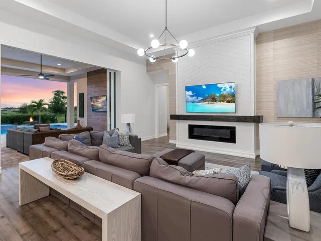 a kitchen with granite countertop white cabinets and a stove