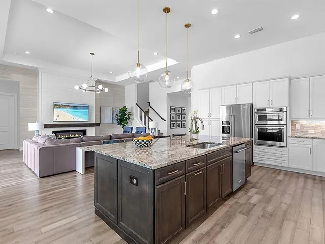 a view of a dining room with a table and chairs