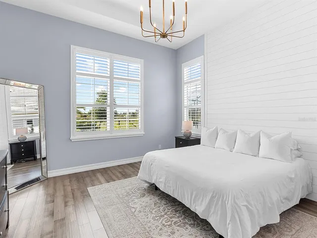 a bathroom with a sink a toilet a shower curtain and a mirror