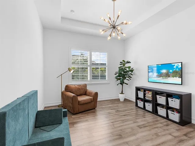 a bathroom with a granite countertop sink a toilet and bathtub