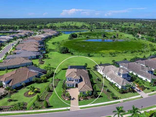an aerial view of a golf course with outdoor space