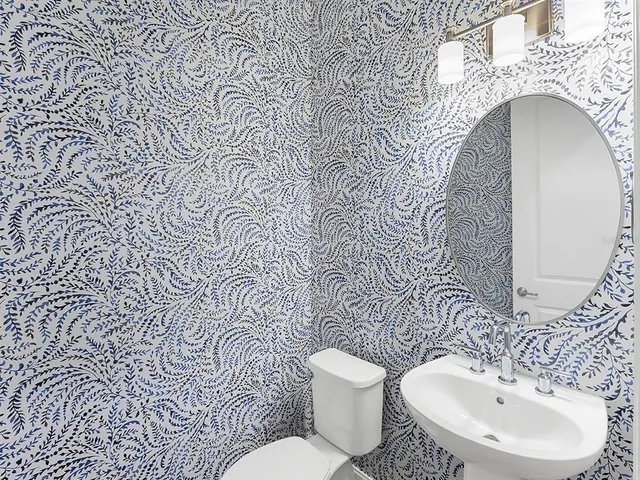 an aerial view of a house with a yard basket ball court