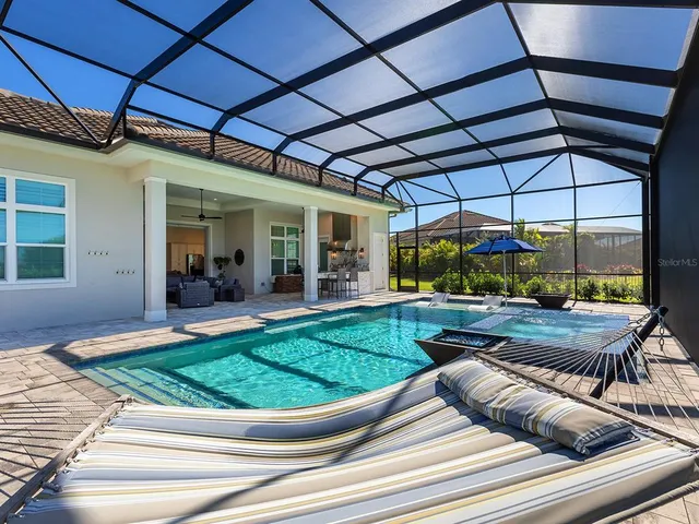 a large room with lots of counter space and painting on the wall