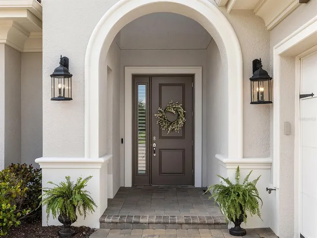 a view of an entryway with wooden floor and stairs
