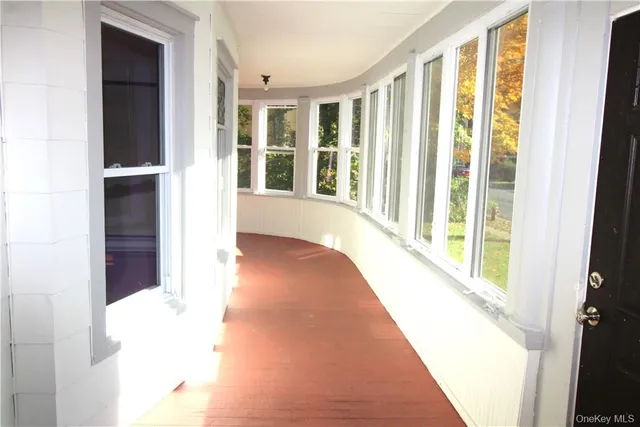 a view of a room with a large window