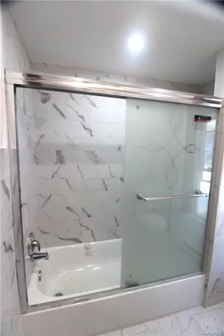 a bathroom with a sink toilet and mirror