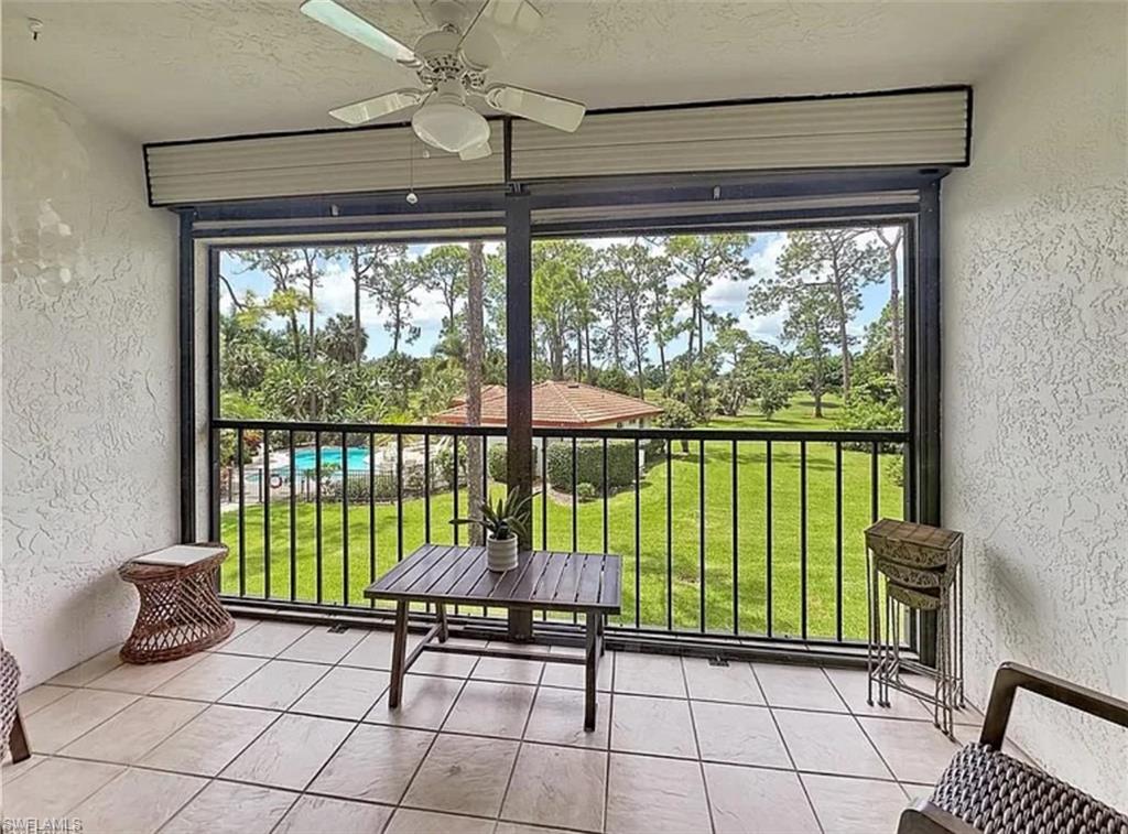 905 Augusta Boulevard Naples, FL 34113 - Photo 18 of 20 a view of a porch with a floor to ceiling window