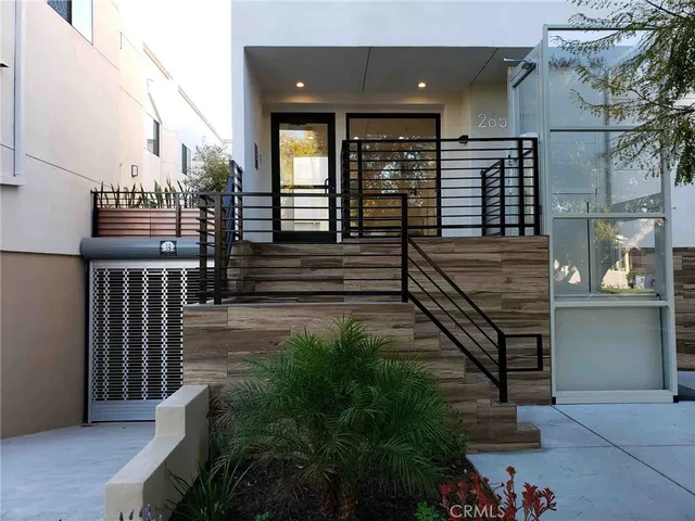 a view of a balcony with stairs and wooden floor