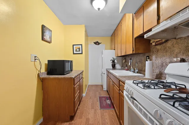 a kitchen with a stove and a refrigerator