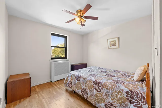 a bedroom with a bed and a chair