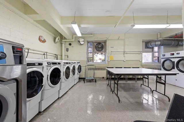 a kitchen with a stove a table and chairs