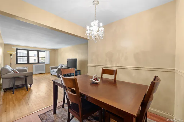 a view of a dining room with furniture and window