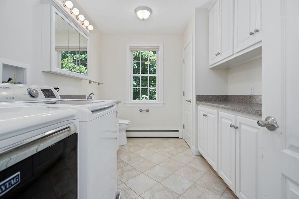 31 Fuller Road Needham, MA 02492 - Photo 24 of 42 a view of a bathroom with dual sinks