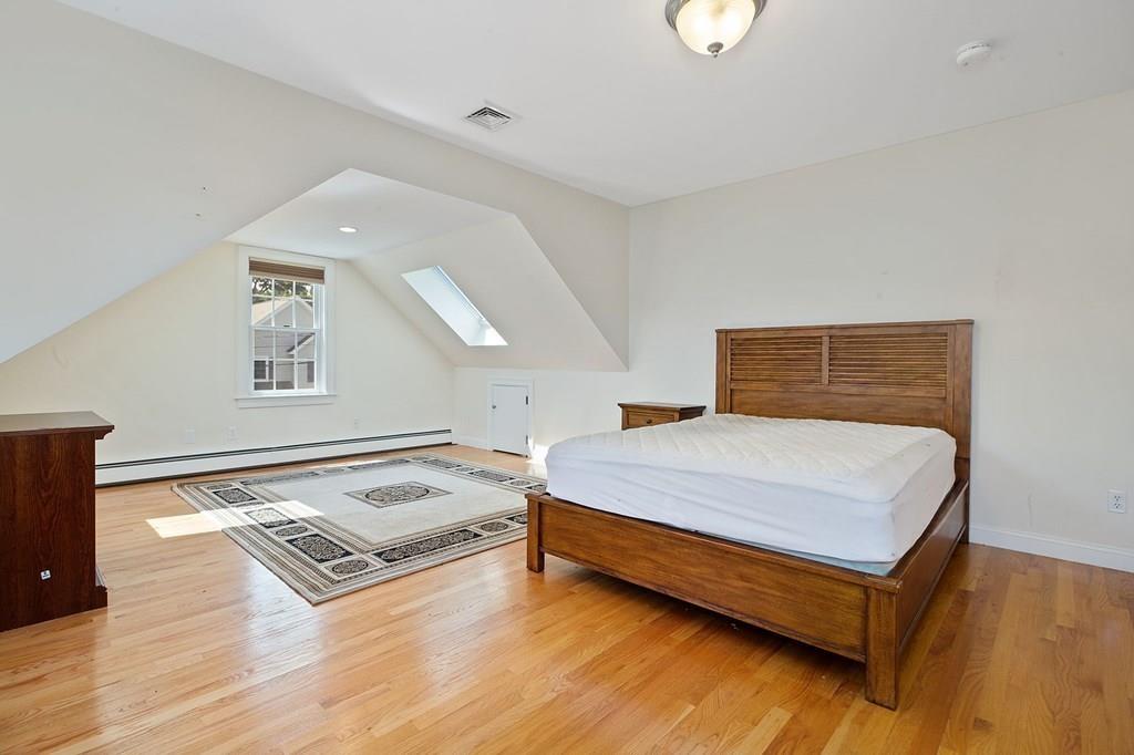 31 Fuller Road Needham, MA 02492 - Photo 25 of 42 a bedroom with a bed and window