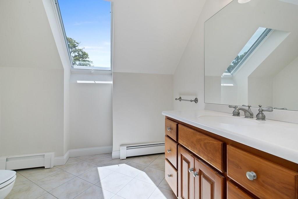 31 Fuller Road Needham, MA 02492 - Photo 27 of 42 a bathroom with a sink and a mirror