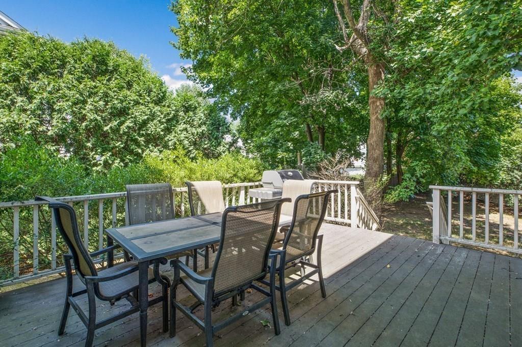 31 Fuller Road Needham, MA 02492 - Photo 31 of 42 a view of a wooden deck and outdoor seating