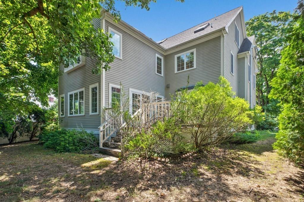 31 Fuller Road Needham, MA 02492 - Photo 34 of 42 a front view of a house with garden