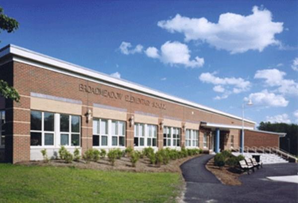 31 Fuller Road Needham, MA 02492 - Photo 41 of 42 a front view of a house with garden and plants