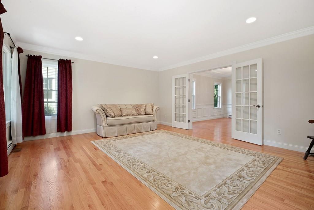 31 Fuller Road Needham, MA 02492 - Photo 7 of 42 a spacious bedroom with a large bed and a dresser