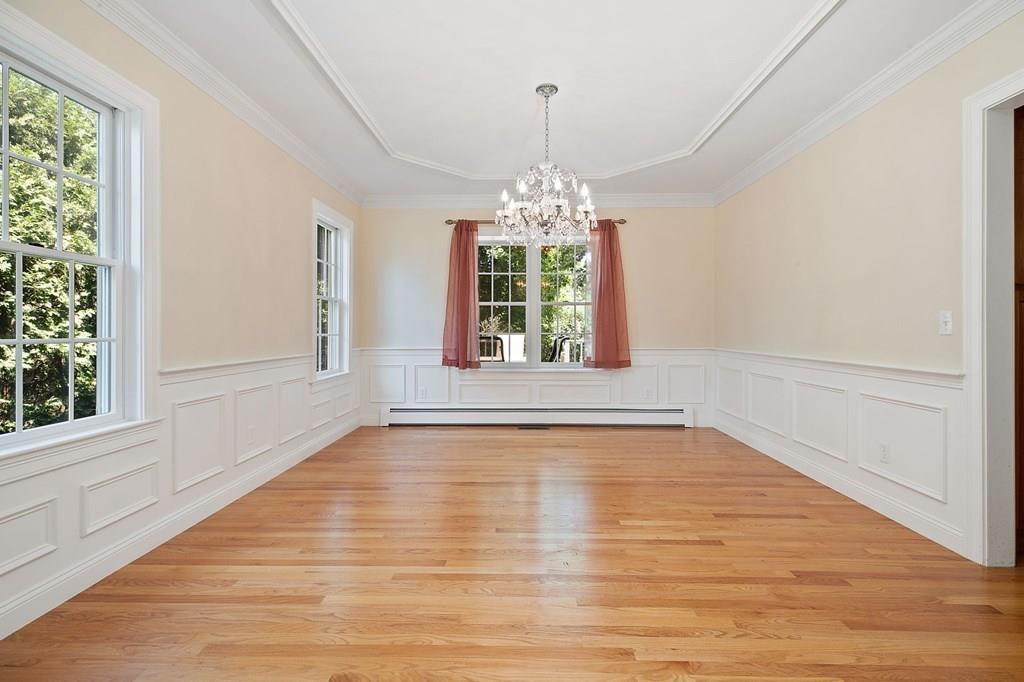 31 Fuller Road Needham, MA 02492 - Photo 8 of 42 a view of an empty room with chandelier and wooden floor