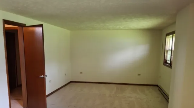 a white refrigerator freezer sitting inside of a kitchen