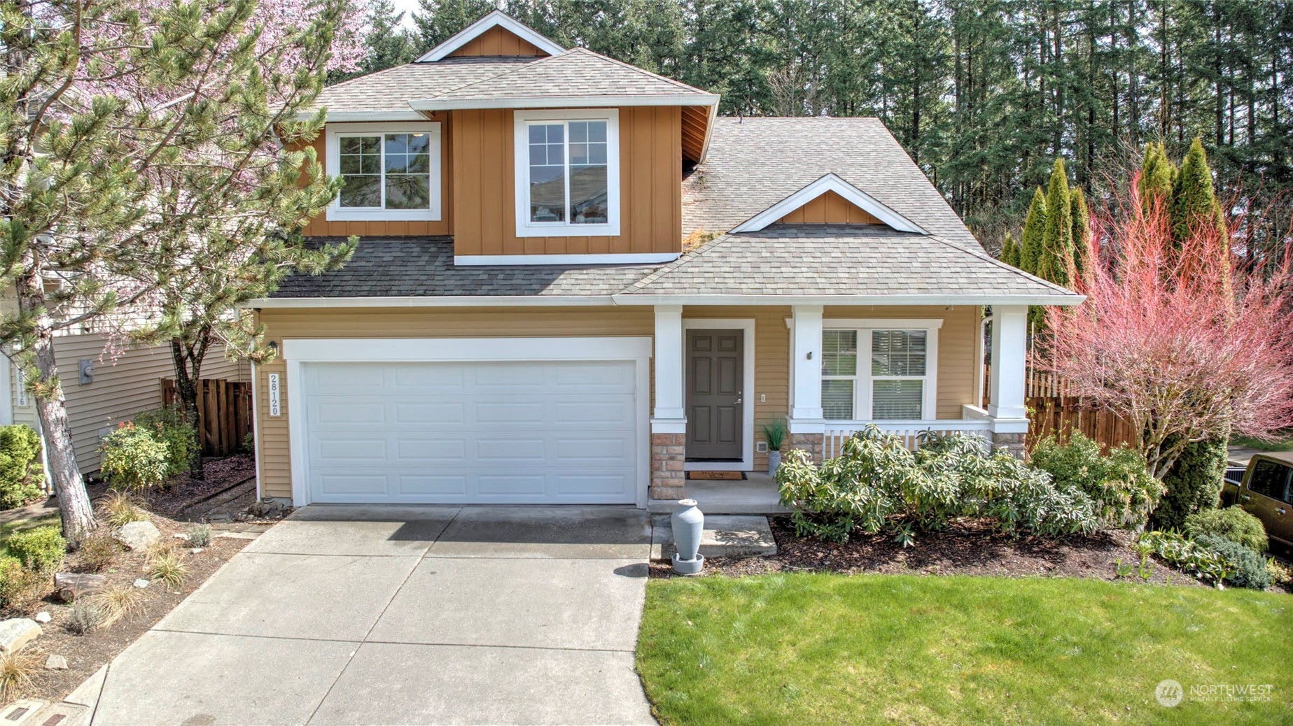 a front view of a house with garden