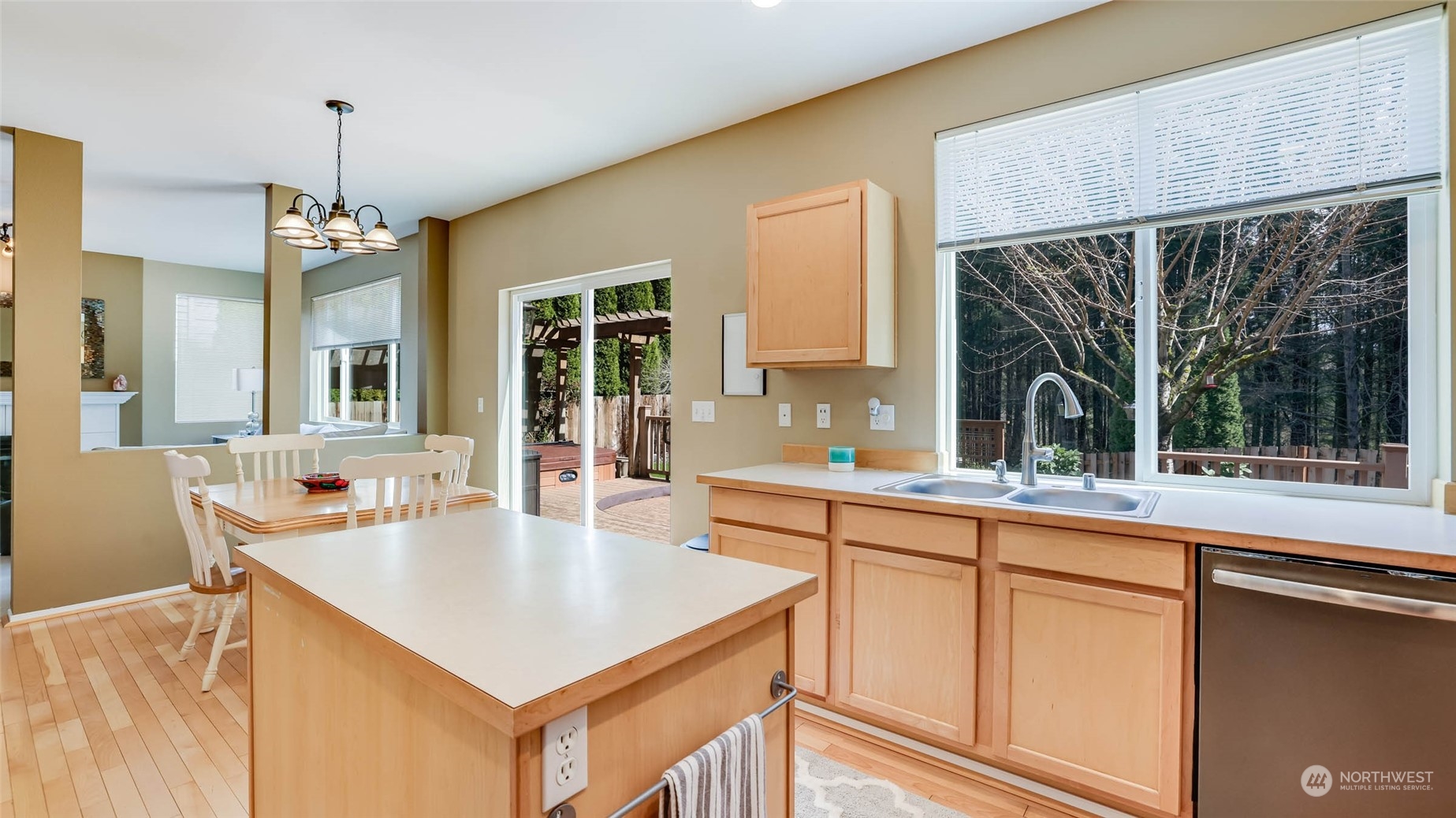 28120 Maple Ridge Way Southeast Maple Valley, WA 98038 - Photo 11 of 36 a kitchen with stainless steel appliances granite countertop a sink and a refrigerator