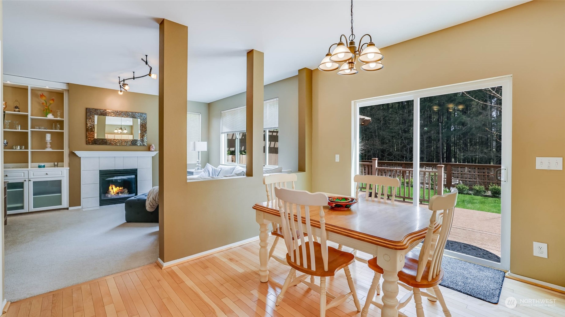 28120 Maple Ridge Way Southeast Maple Valley, WA 98038 - Photo 13 of 36 a dining room with furniture fireplace and a chandelier