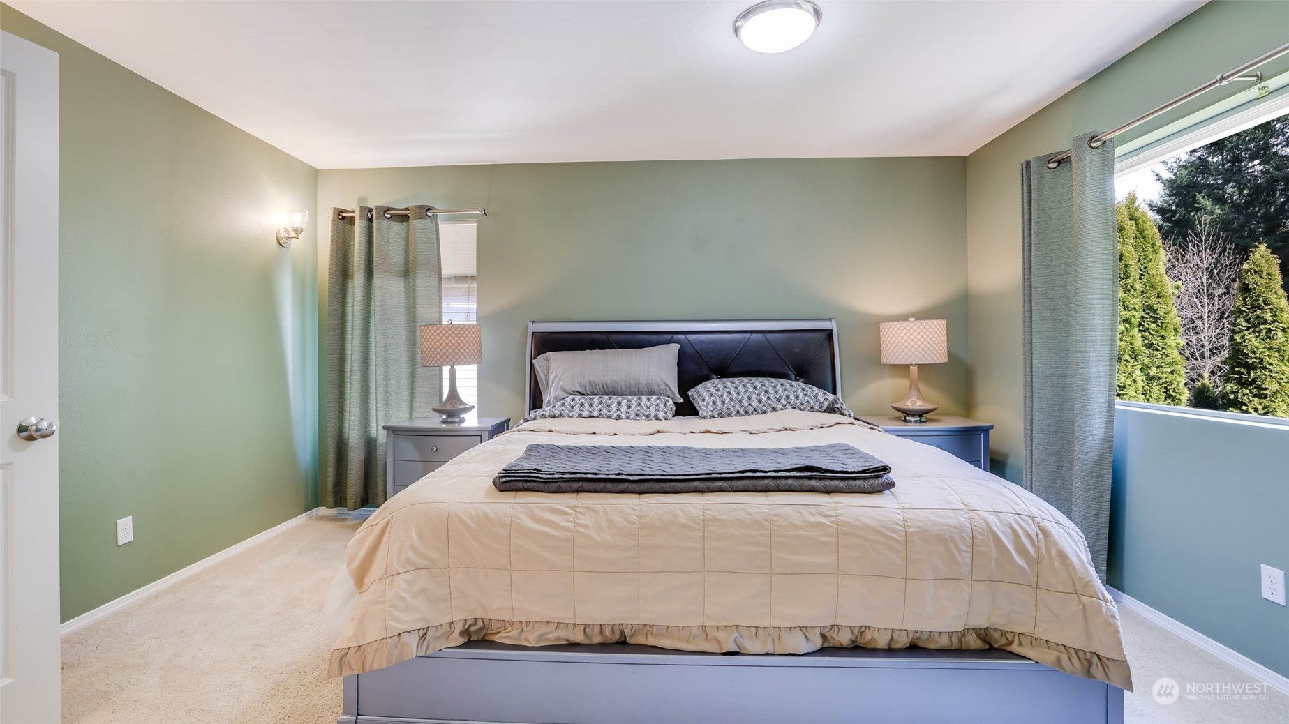 28120 Maple Ridge Way Southeast Maple Valley, WA 98038 - Photo 18 of 36 a bedroom with a bed and a window