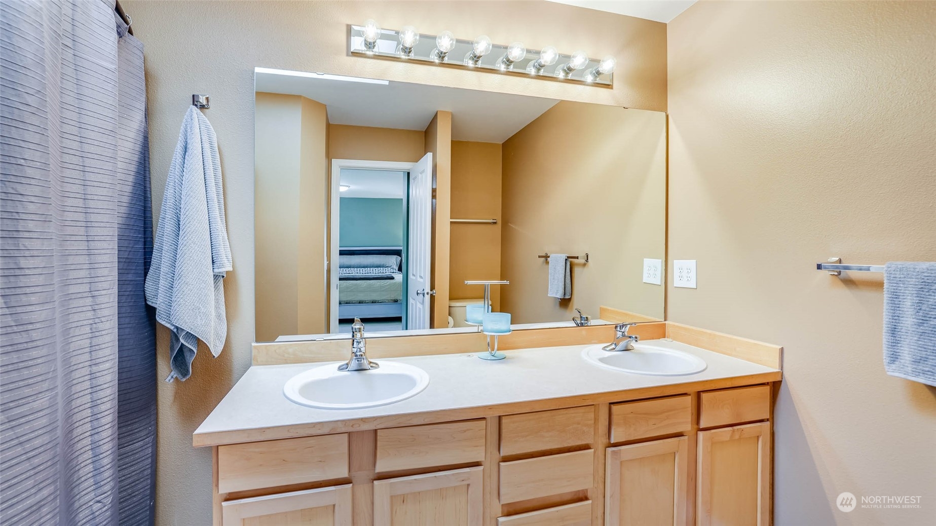 28120 Maple Ridge Way Southeast Maple Valley, WA 98038 - Photo 19 of 36 a bathroom with a sink and a mirror