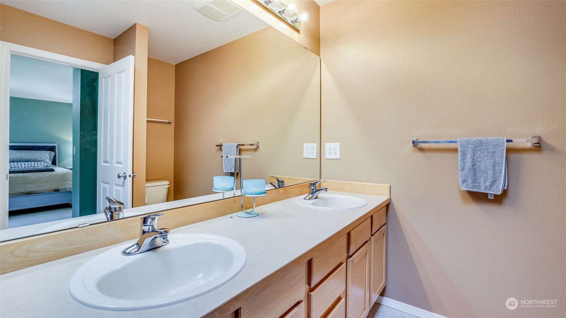28120 Maple Ridge Way Southeast Maple Valley, WA 98038 - Photo 20 of 36 a bathroom with a sink and a mirror