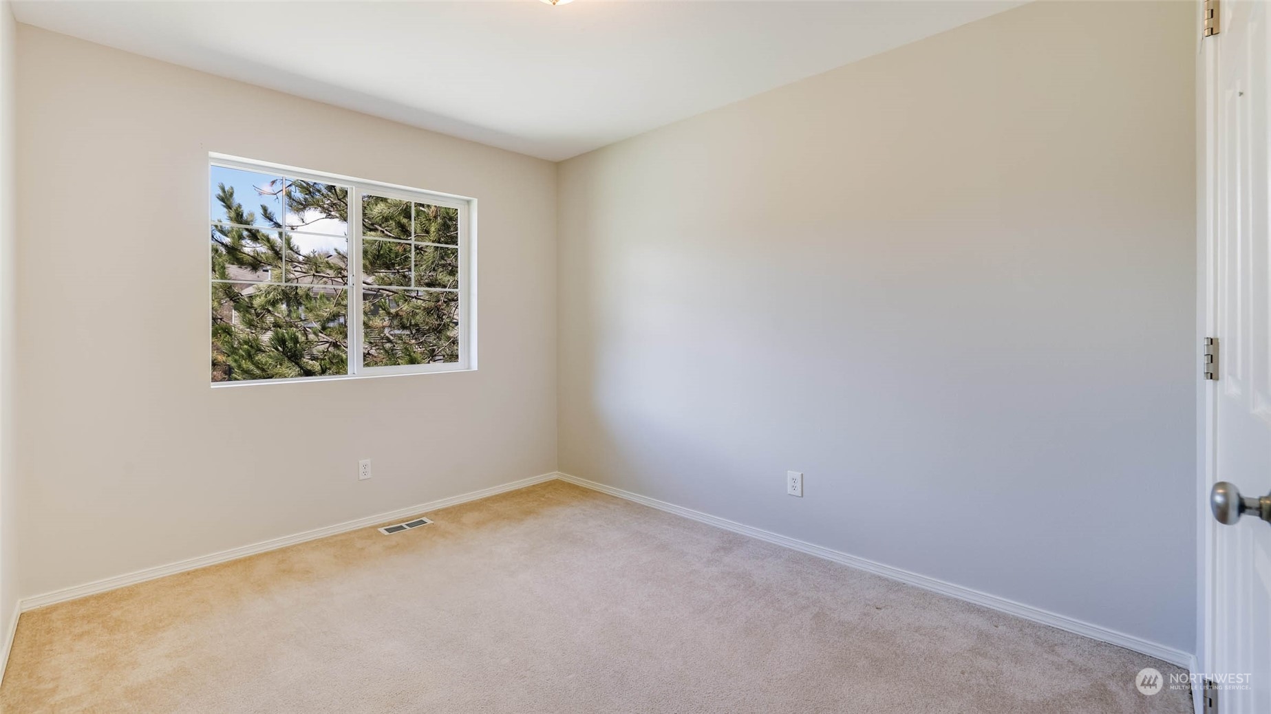 28120 Maple Ridge Way Southeast Maple Valley, WA 98038 - Photo 23 of 36 an empty room with a window