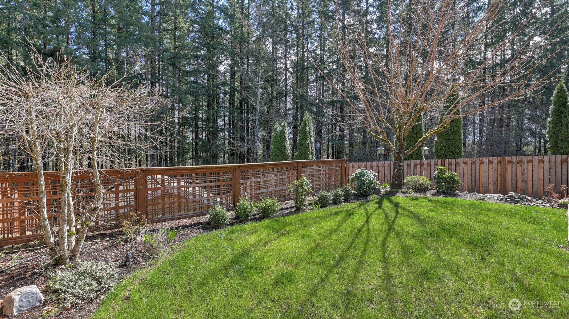 28120 Maple Ridge Way Southeast Maple Valley, WA 98038 - Photo 28 of 36 a view of backyard with wooden fence
