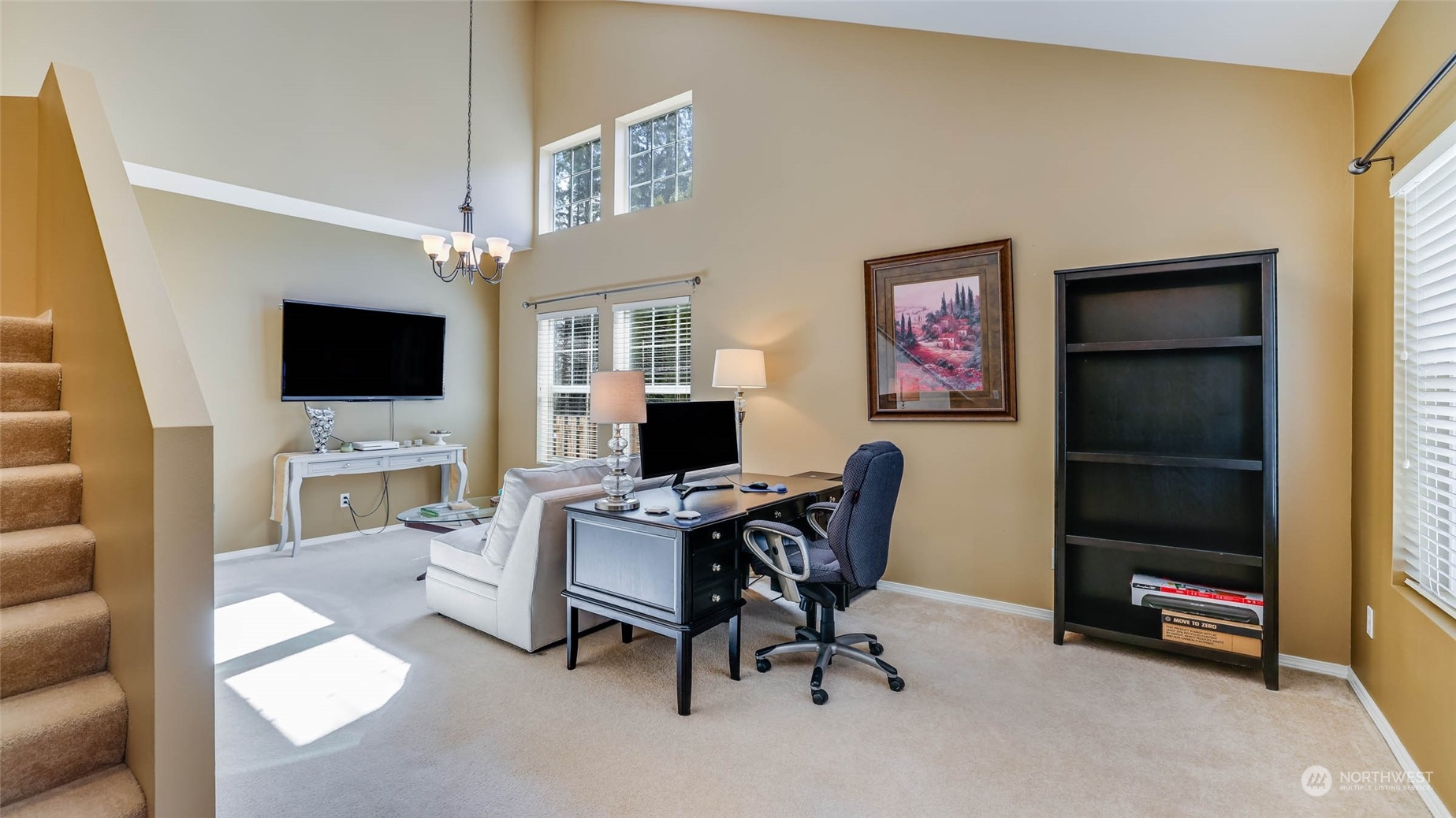 28120 Maple Ridge Way Southeast Maple Valley, WA 98038 - Photo 4 of 36 a view of a livingroom with workspace and a couch