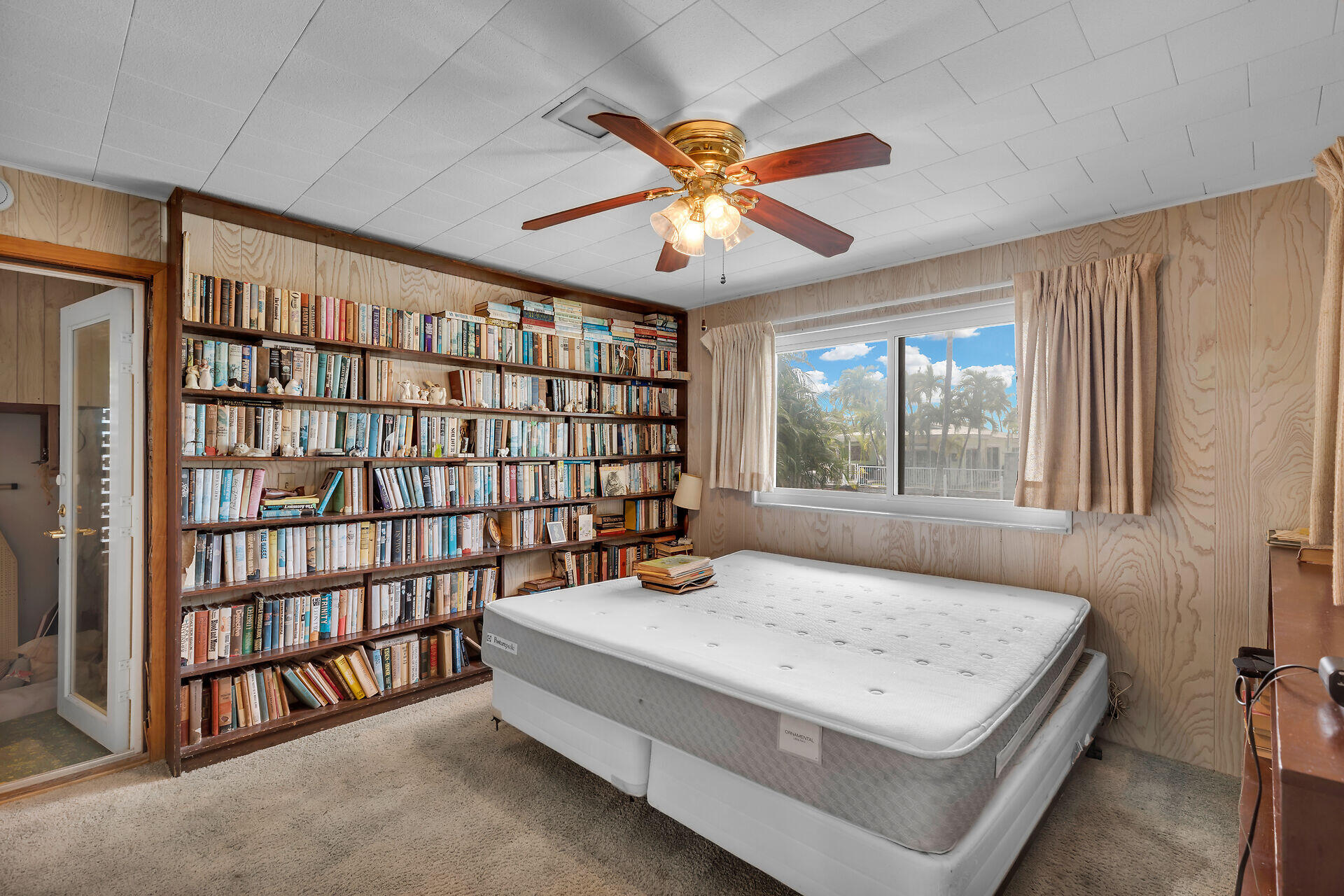 1600 Bahama Drive Key West, FL 33040 - Photo 23 of 41 a bedroom with a large bed and a chandelier