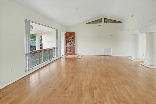 a view of an empty room with glass door