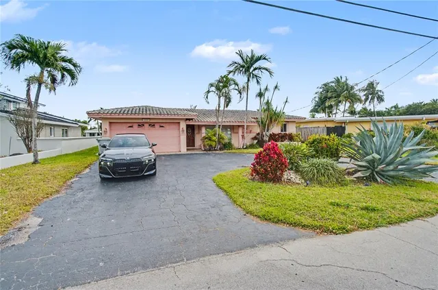 a house with palm tree in the background
