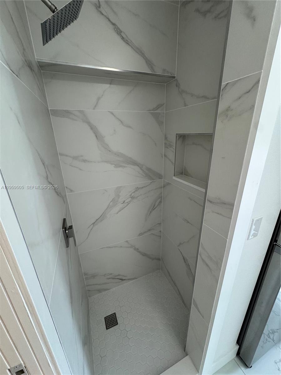 19530 Southwest 210th Street Miami, FL 33187 - Photo 15 of 20 a bathroom with a shower
