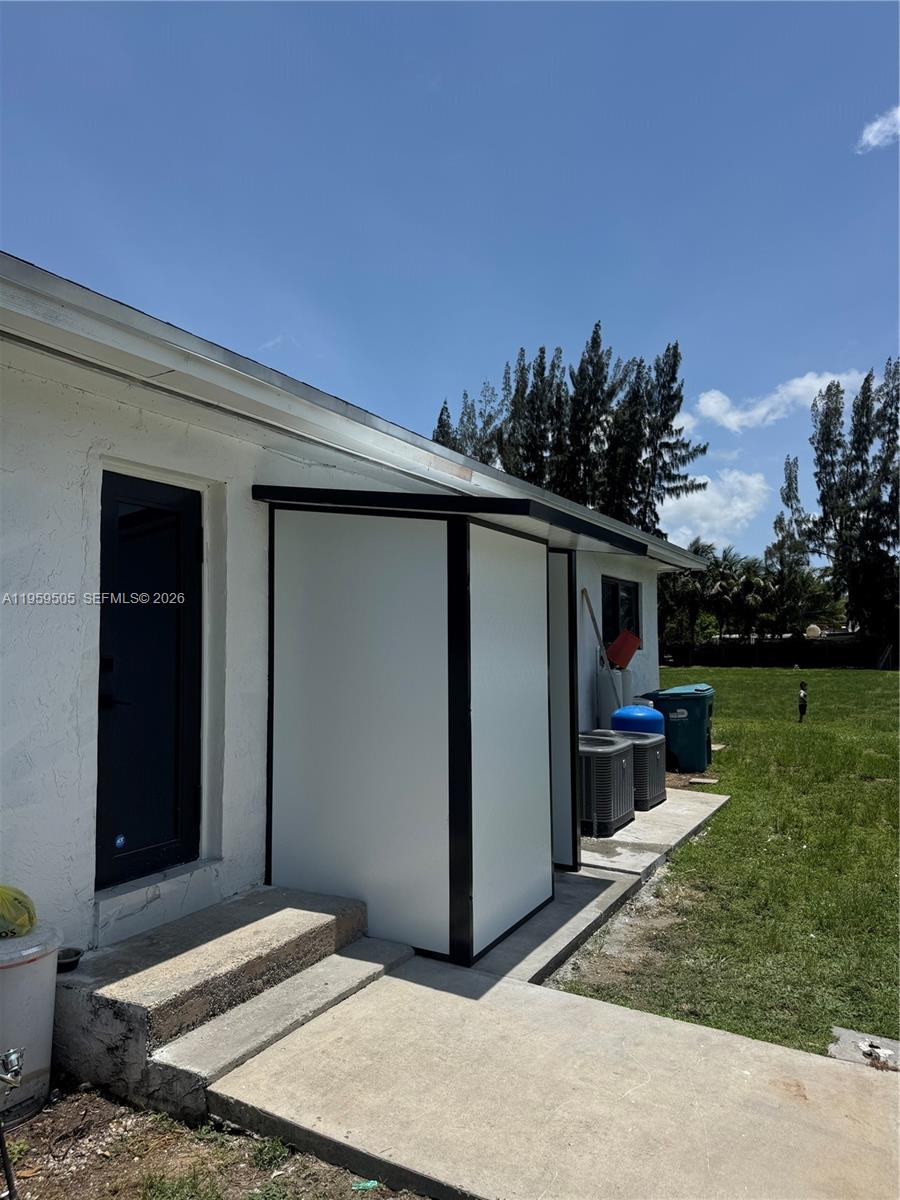 19530 Southwest 210th Street Miami, FL 33187 - Photo 17 of 20 a backyard of a house with lots of green space