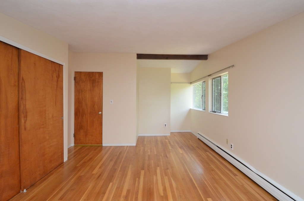 39 Peacock Farm Road Lexington, MA 02421 - Photo 11 of 30 a view of wooden floor in an empty room