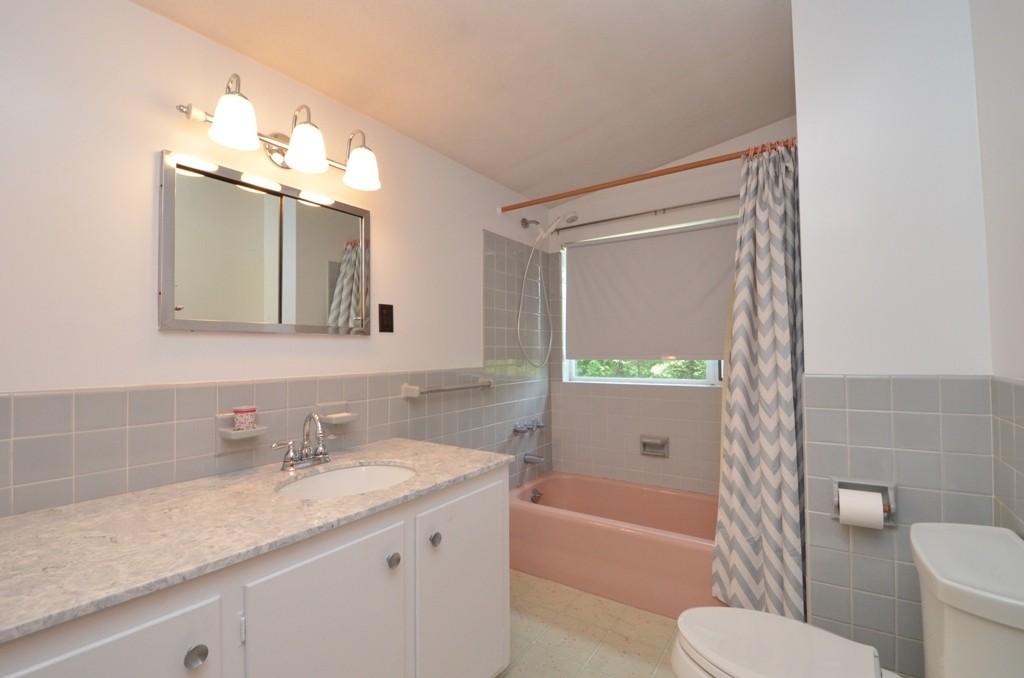 39 Peacock Farm Road Lexington, MA 02421 - Photo 12 of 30 a bathroom with a granite countertop sink toilet and shower