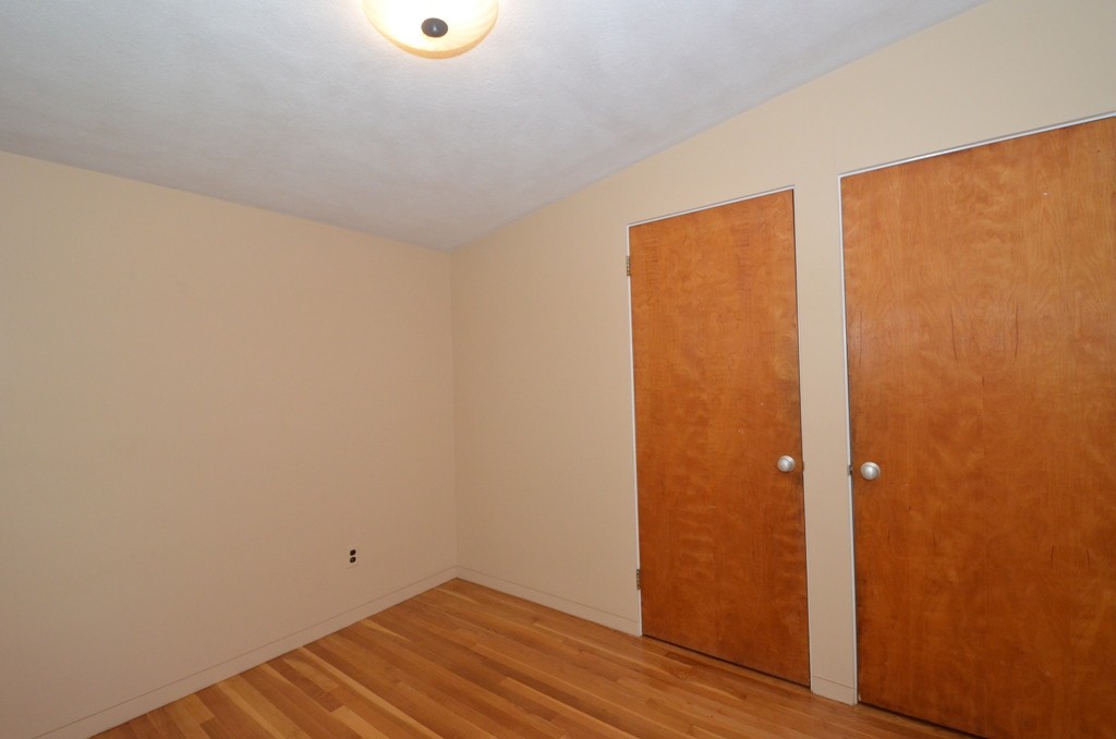 39 Peacock Farm Road Lexington, MA 02421 - Photo 16 of 30 a view of a room with wooden floor and bench