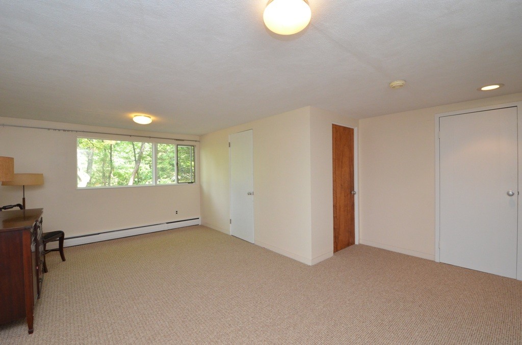 39 Peacock Farm Road Lexington, MA 02421 - Photo 19 of 30 a view of an empty room with a window