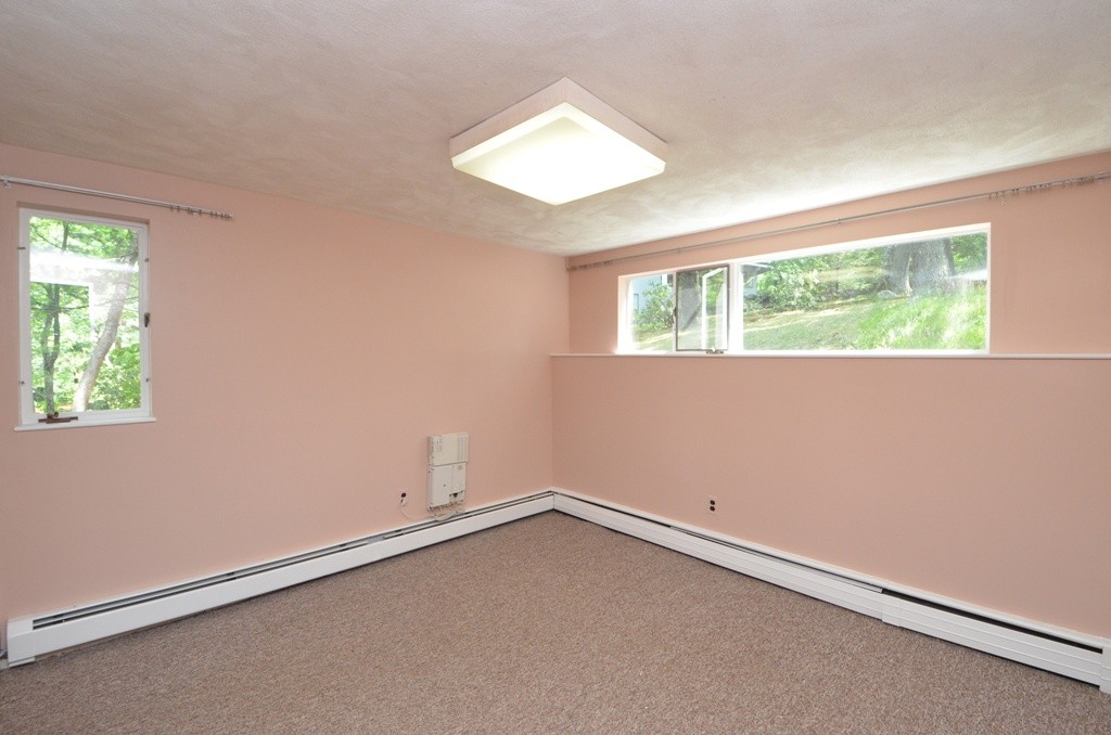 39 Peacock Farm Road Lexington, MA 02421 - Photo 22 of 30 an empty room with a window