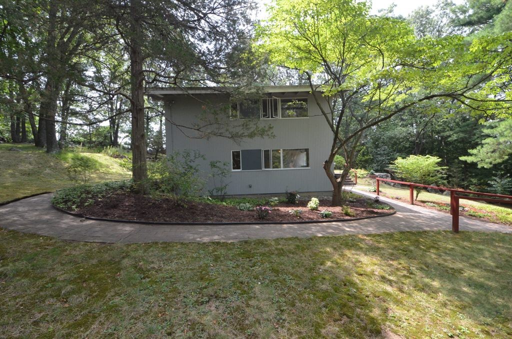 39 Peacock Farm Road Lexington, MA 02421 - Photo 27 of 30 a front view of a house with garden