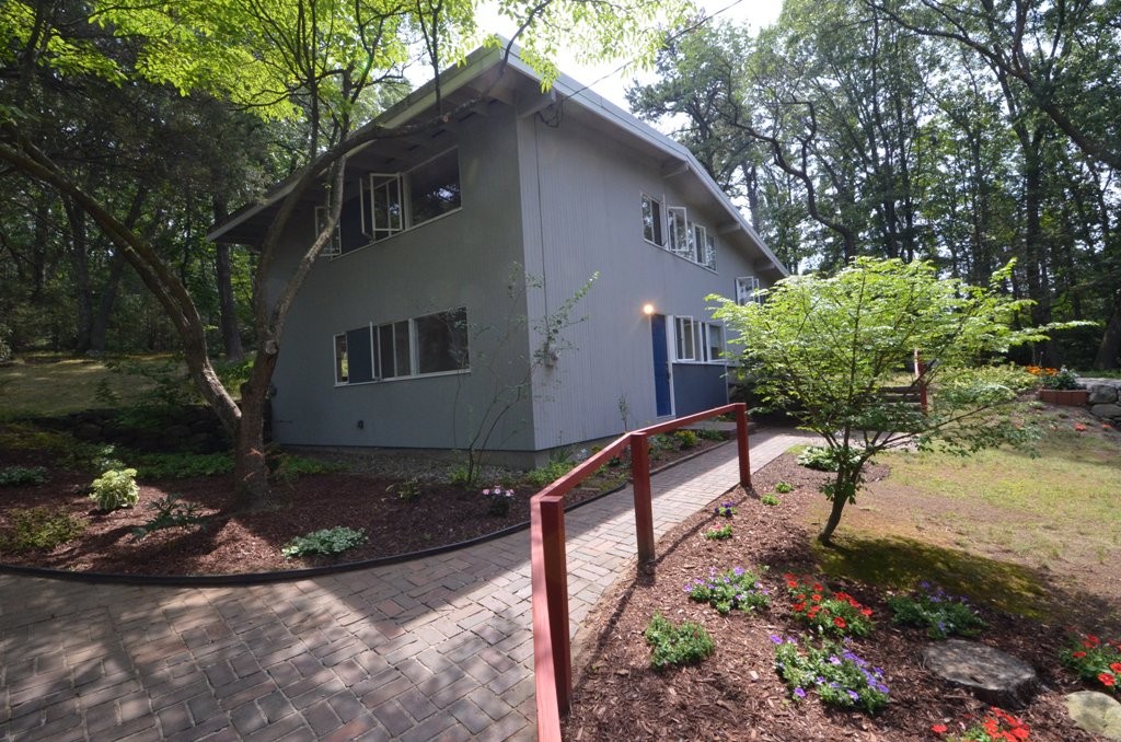 39 Peacock Farm Road Lexington, MA 02421 - Photo 28 of 30 a house view with a garden space