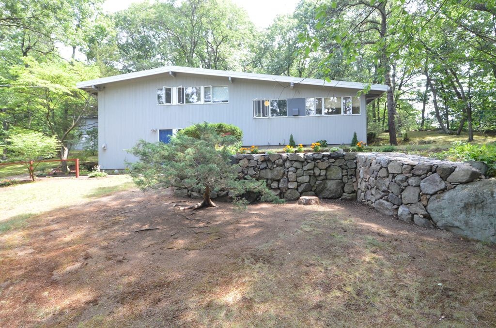 39 Peacock Farm Road Lexington, MA 02421 - Photo 29 of 30 a view of a house with a yard