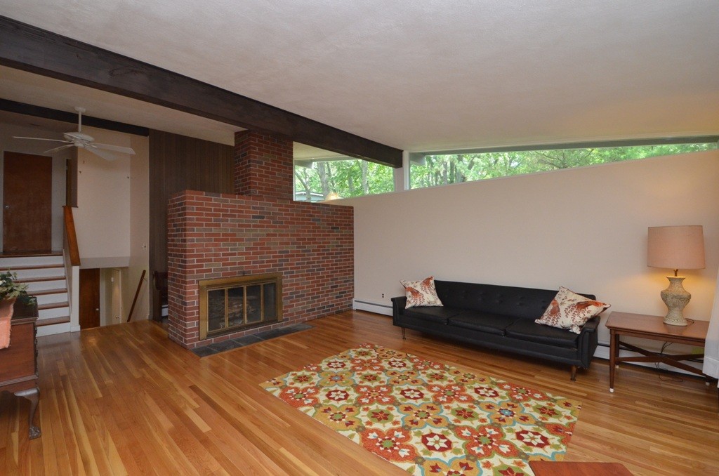 39 Peacock Farm Road Lexington, MA 02421 - Photo 3 of 30 a living room with furniture and a fireplace