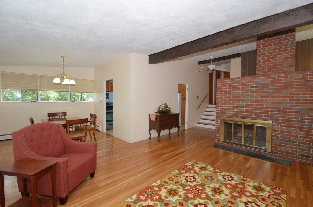 39 Peacock Farm Road Lexington, MA 02421 - Photo 4 of 30 a living room with furniture and a fireplace