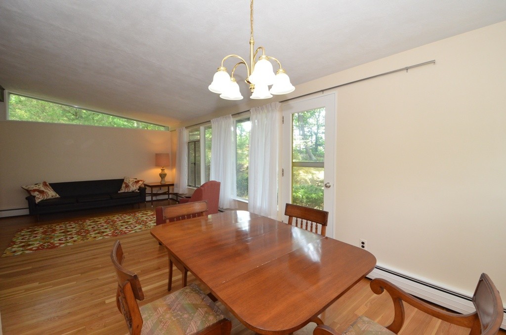 39 Peacock Farm Road Lexington, MA 02421 - Photo 6 of 30 a view of a dining room with furniture window and wooden floor